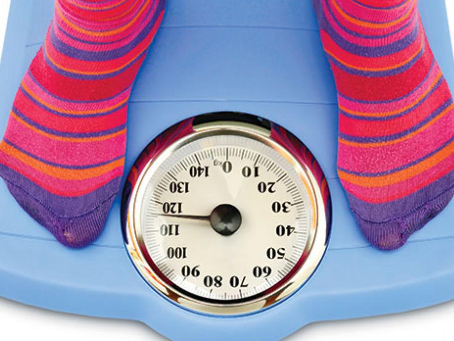 teenager on scales