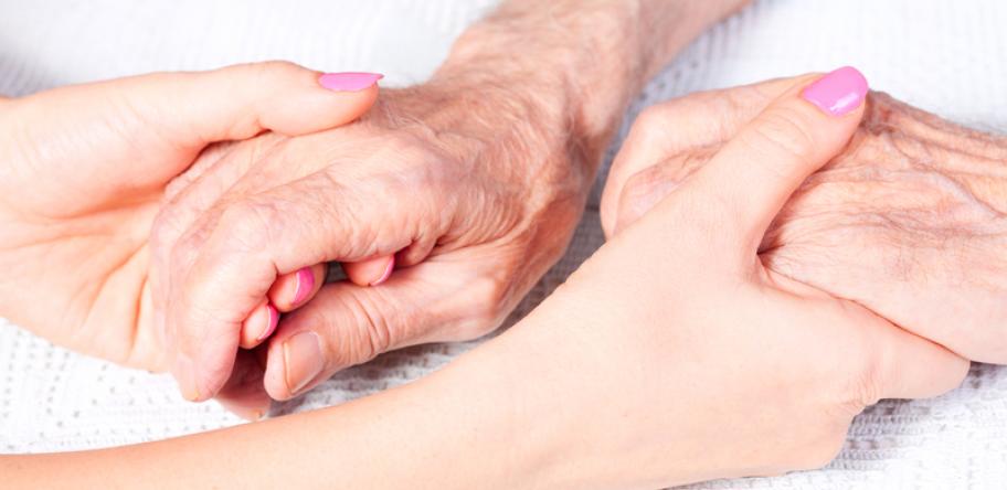 holding elderly hands