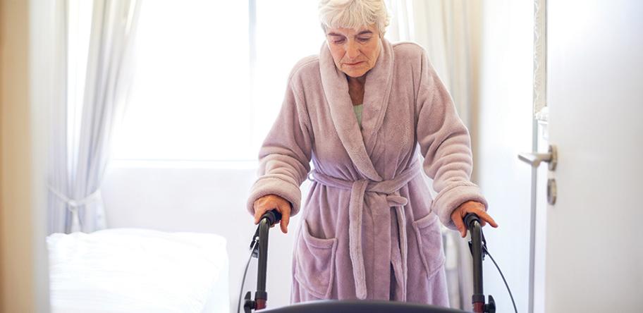 senior woman mobility walker walking frame