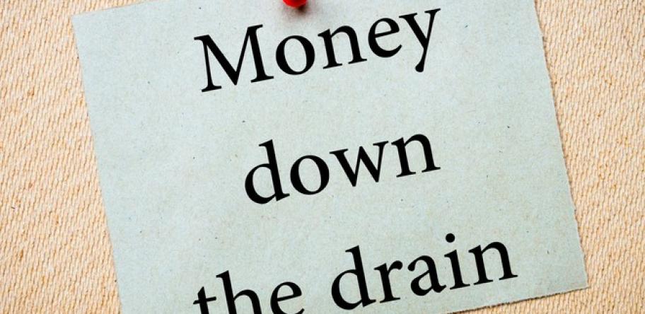 money down the drain sign