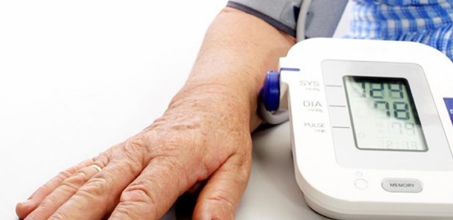 Old man having blood pressure measured